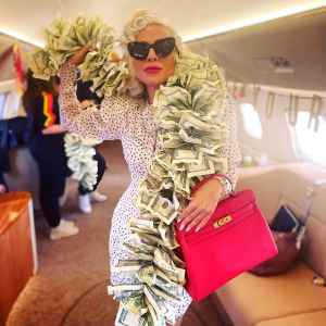 ‘Vegas Baby!' Lady Gaga Wears Boa Made of $100 Bills and Pink Hermès Birkin on Private Jet