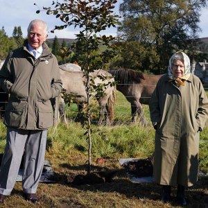 Queen Elizabeth Meets Local Schoolchildren During Outing With Prince Charles