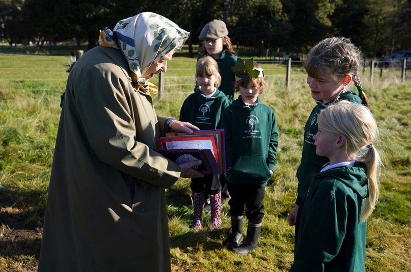 Queen Elizabeth Meets Local Schoolchildren During Outing With Prince Charles