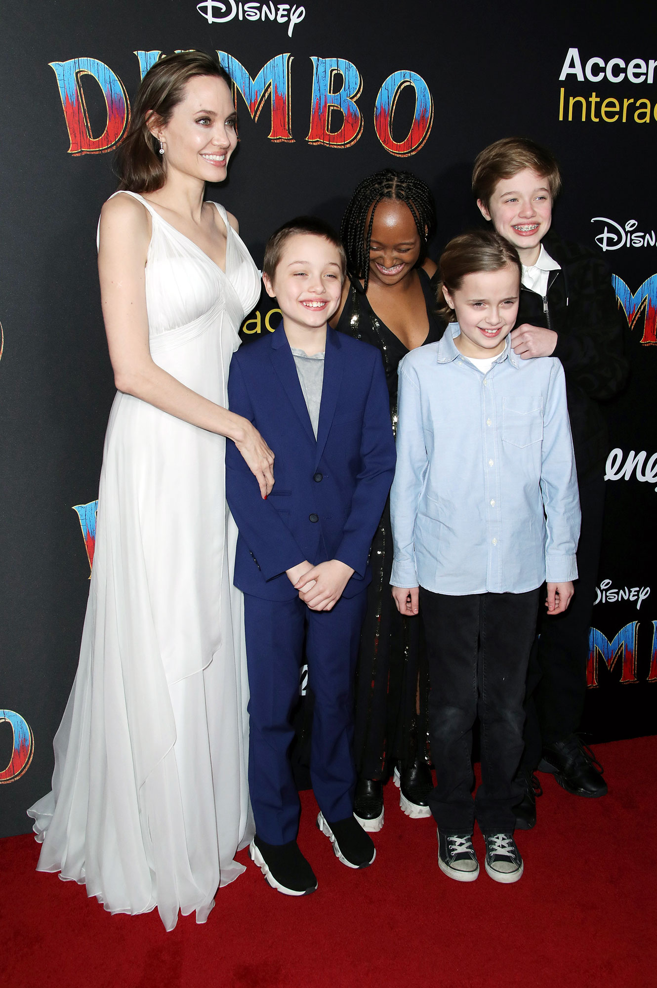 Shiloh Jolie-Pitt’s Red Carpet Style Through the Years From Traditional Tuxedos to Dior Dresses