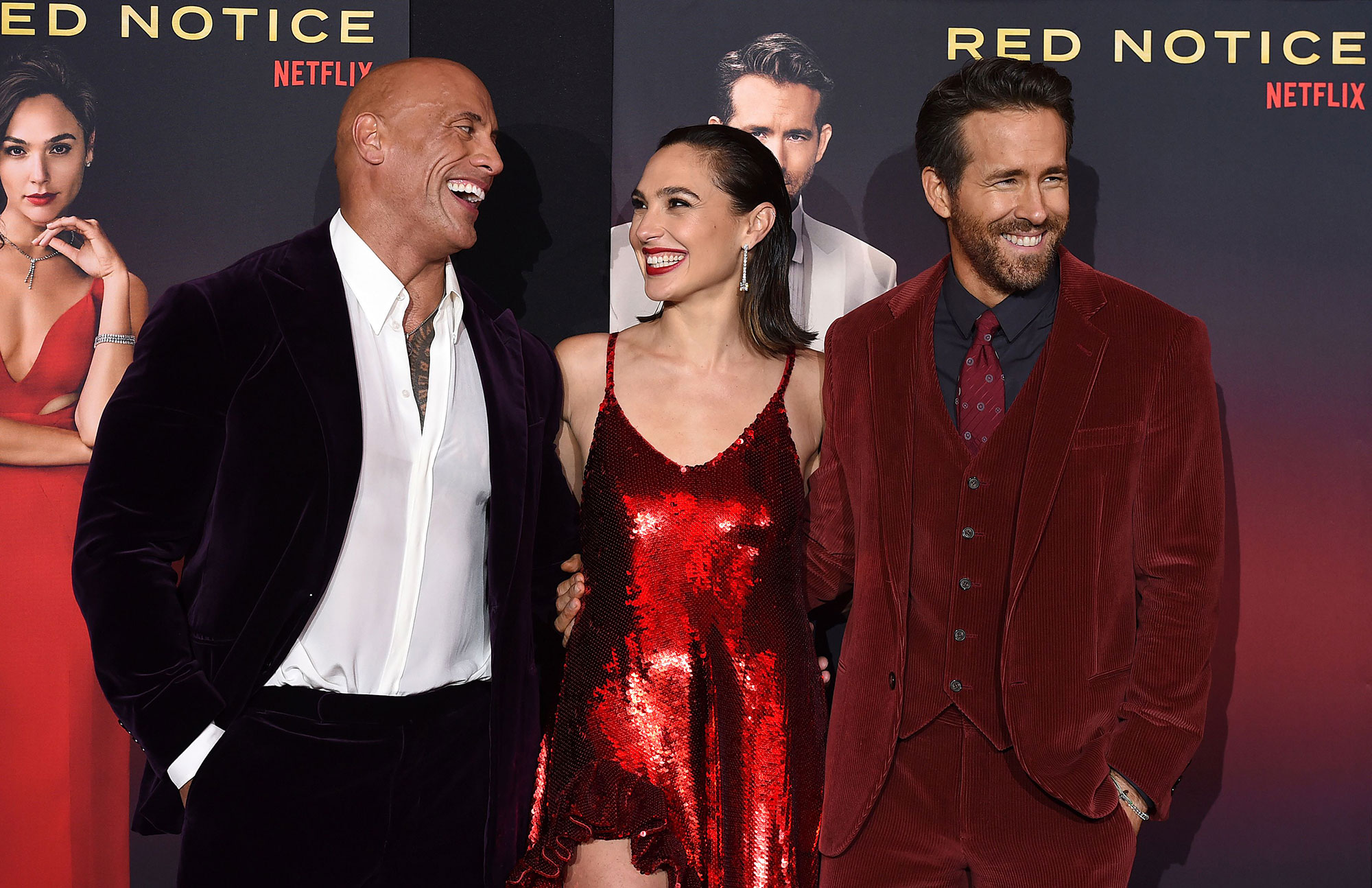 https://www.usmagazine.com/wp-content/uploads/2021/11/Color-Coordinated-Costars-Gal-Gadot-Ryan-Reynolds-and-Dwayne-The-Rock-Johnson-Match-at-Red-Notice-Premiere-2.jpg?quality=82&strip=all
