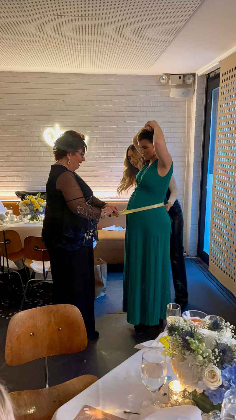 Ashley Iaconetti had her belly measured at her baby shower in New York City.