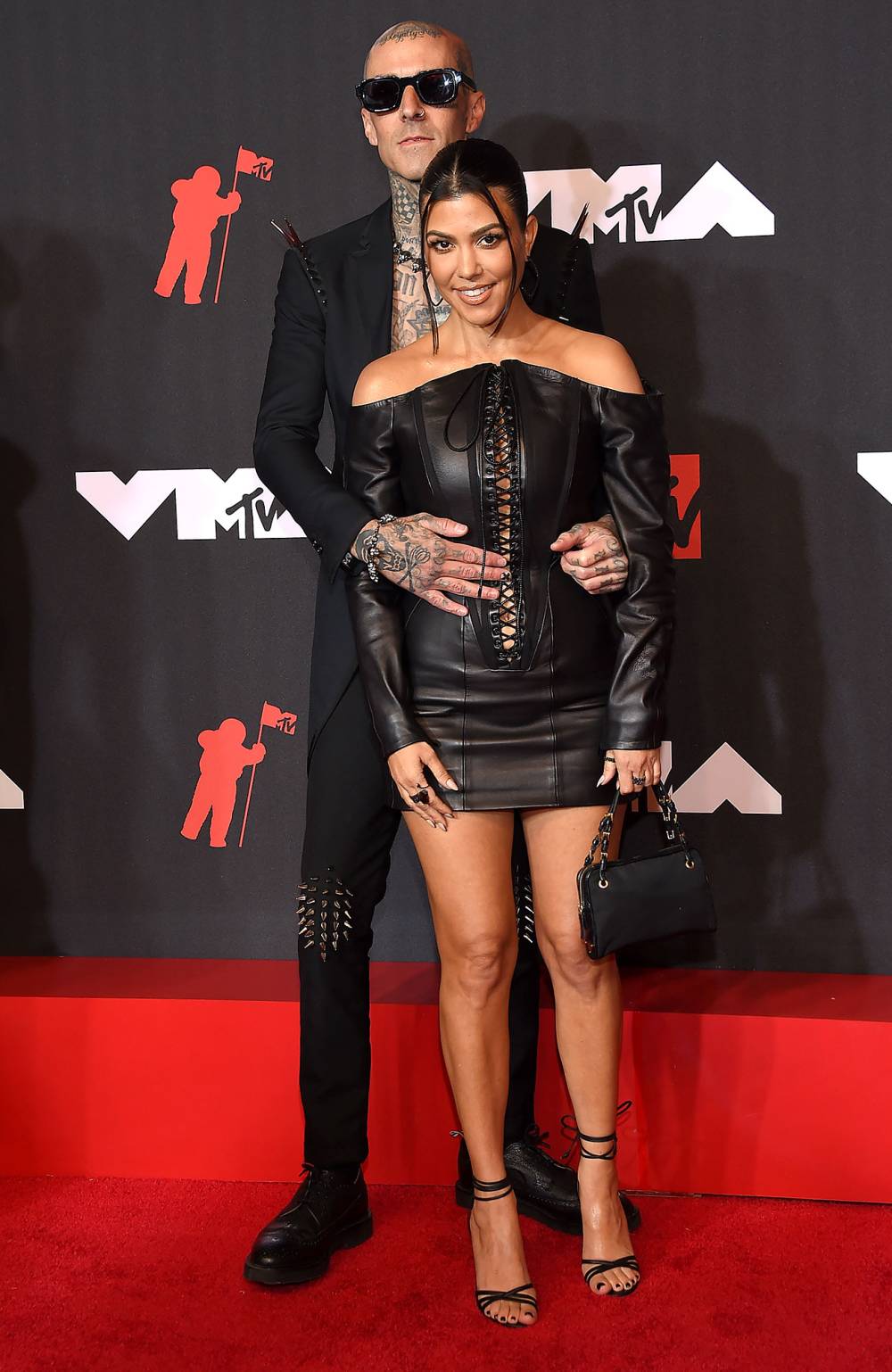 Kourtney Kardashian and Travis Barker Take PDA to Another Level With Christmas-Themed Foot Pic