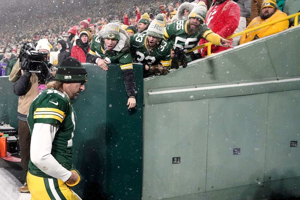 Aaron Rodgers Thinks NFL Fans Were Rooting Against the Packers Because of His Vaccination Status Green Bay Packers Fans Snow Dejected NFC Championship