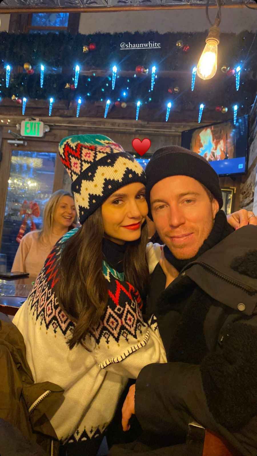 Nina and Shaun White cuddle for a sweet photo.