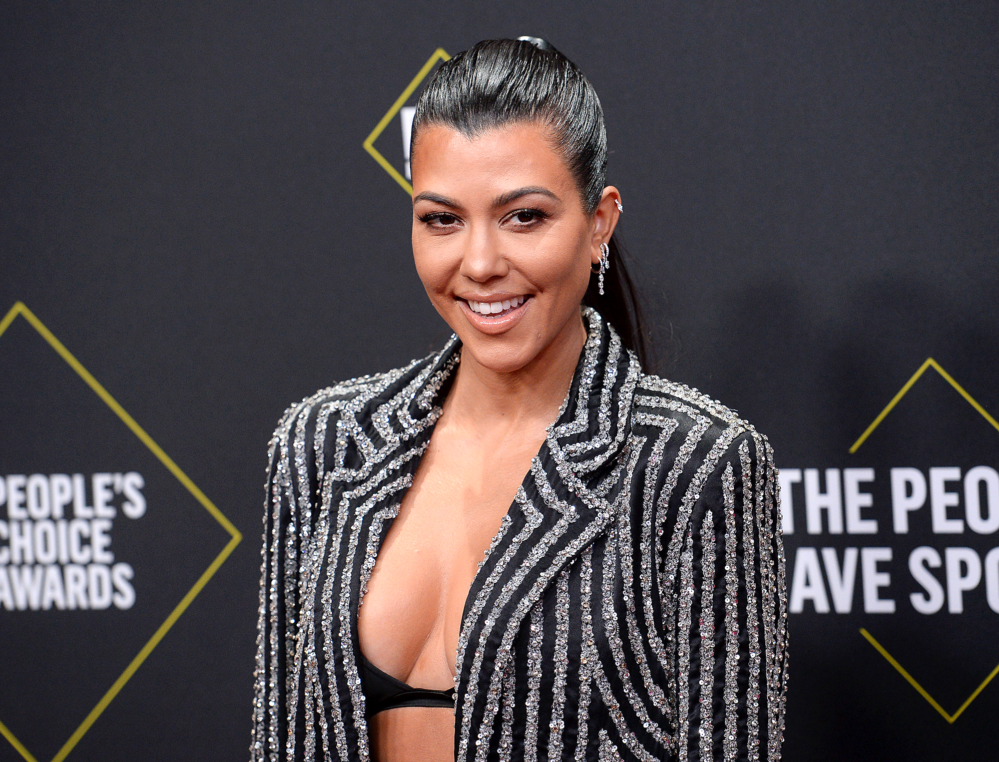 Kourtney Kardashian Just Shared a Throwback Bikini Pic From 2005 — and She Honestly Looks the Same