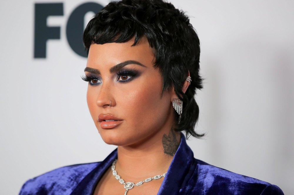 Demi Lovato's Struggle With Addiction in Their Own Words blue velvet suit close up photo
