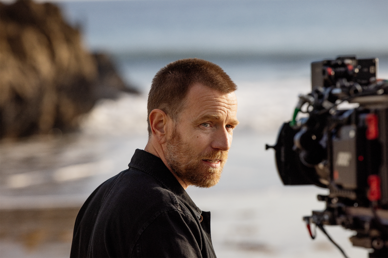 Ewan McGregor films a Super Bowl 2022 commercial for Expedia on the beach.