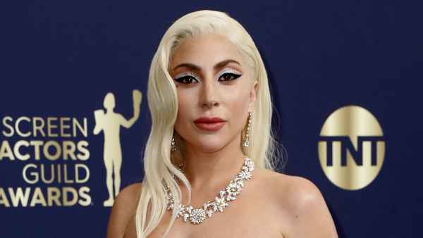 House of Gucci Nominee Lady Gaga Sparkles in White and Gold at the 2022 SAG Awards