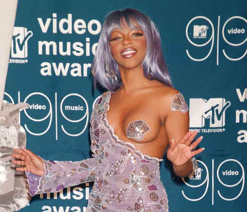 Lil’ Kim: How Her Face Has Changed Through the Years 1999 in Purple
