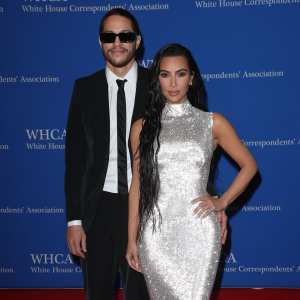 Pete Davidson in suit and sneakers, Kim Kardashian in silver gown