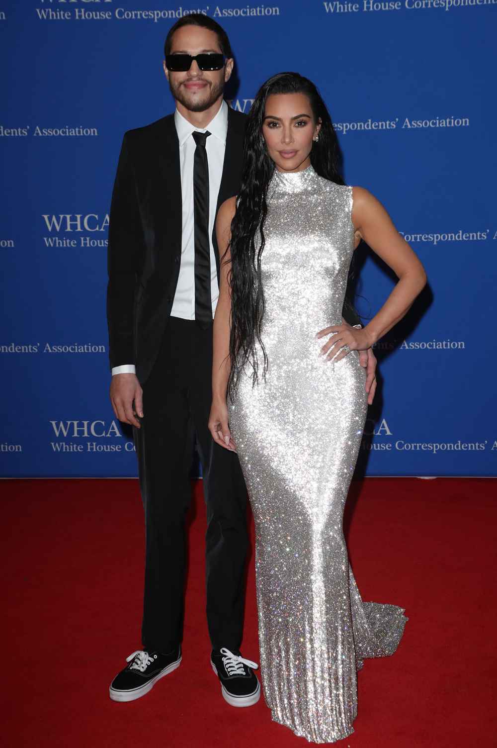 Pete Davidson in suit and sneakers, Kim Kardashian in silver gown