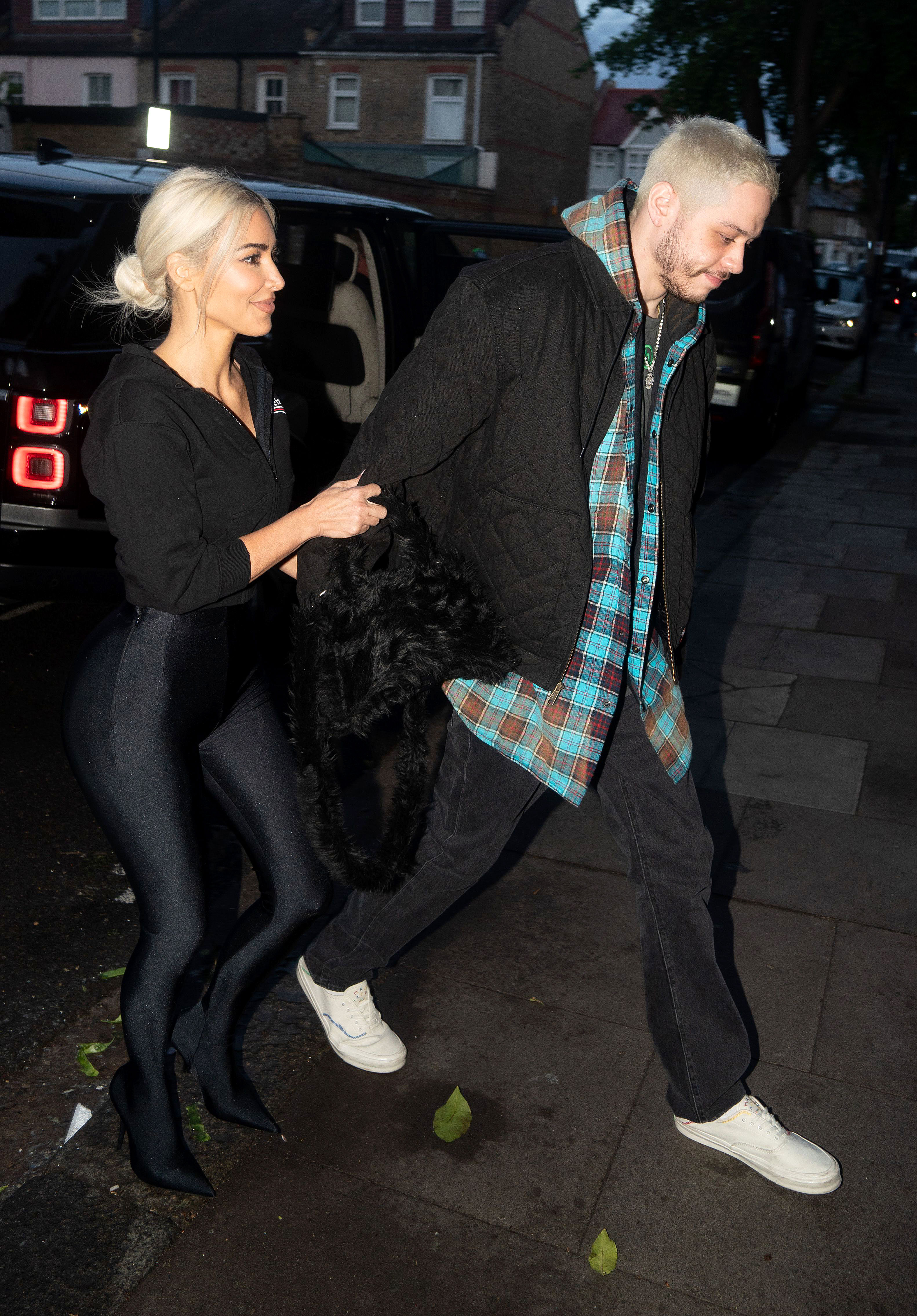 Kim Kardashian Holds Pete Davidson Tight as They Arrive in London 9
