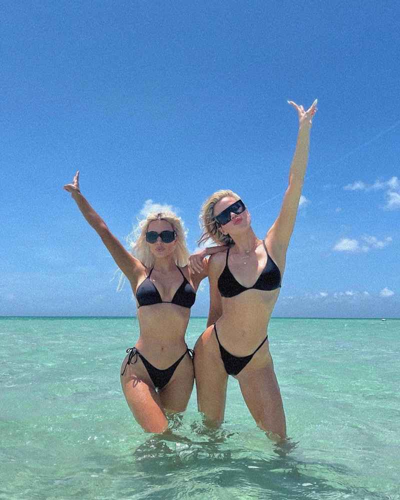 Kim and Khloe wear matching black bikinis
