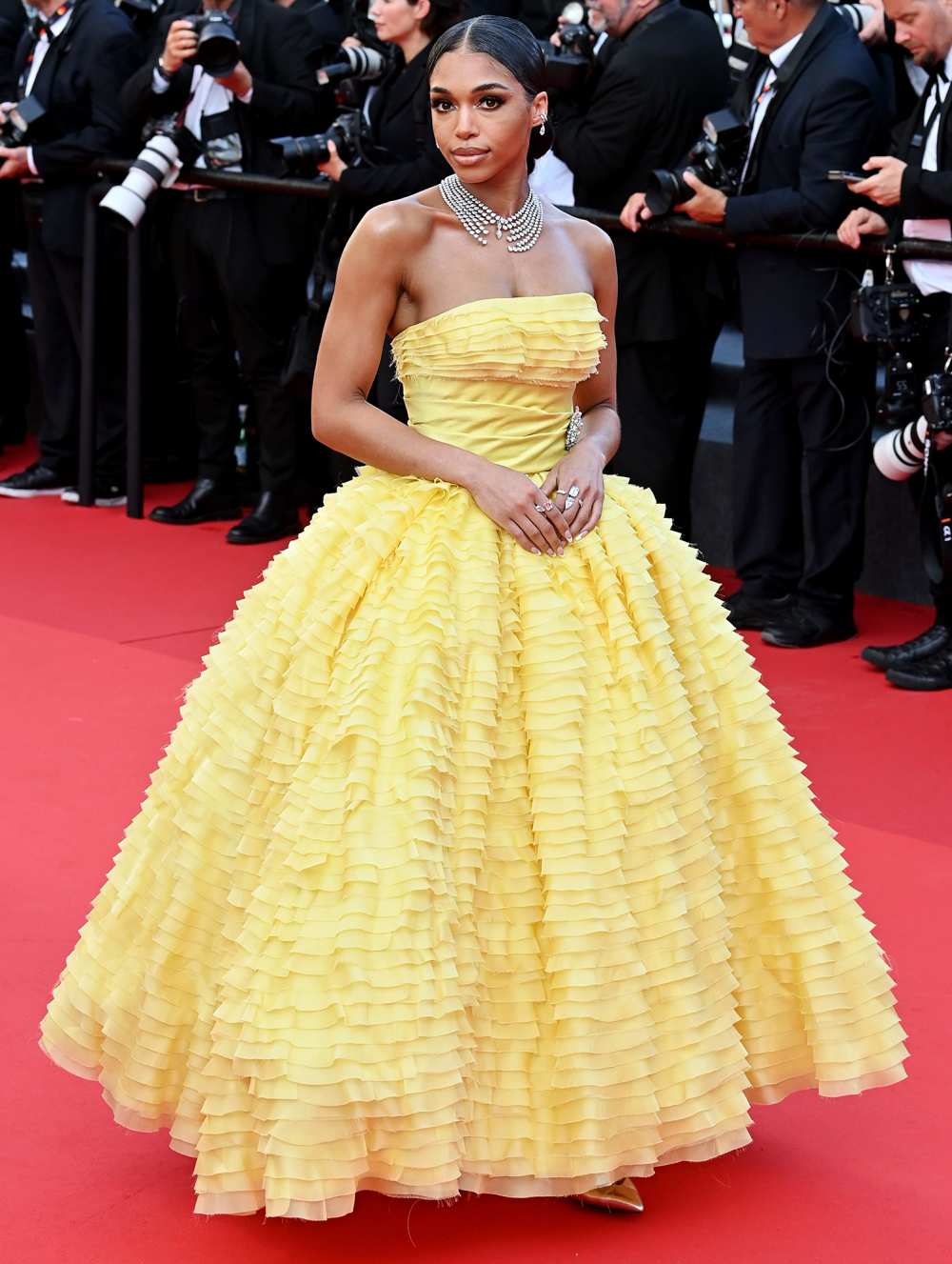 Lori Harvey Says She Felt Like 'Belle' as She Made Her Cannes Debut in Yellow Ruffled Gown