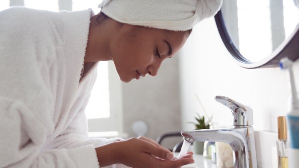 Woman-Washing-Face-Stock-Photo