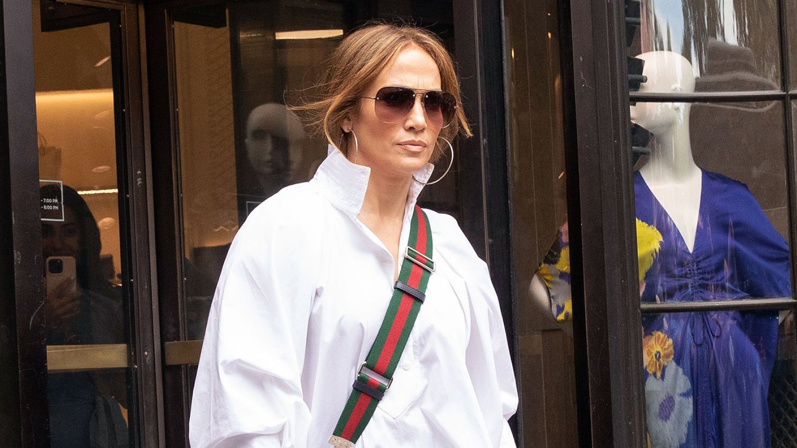 Jennifer Lopez Nails Off-Duty Style in an Oversized Button Up and Denim Shorts