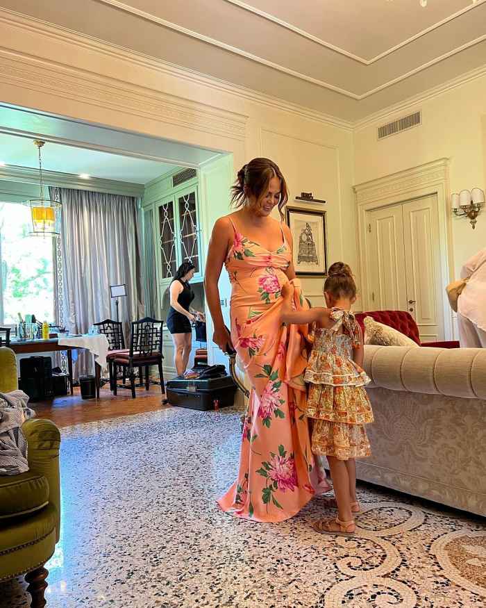Pregnant Chrissy Teigen Wows in a Skintight Floral Dress