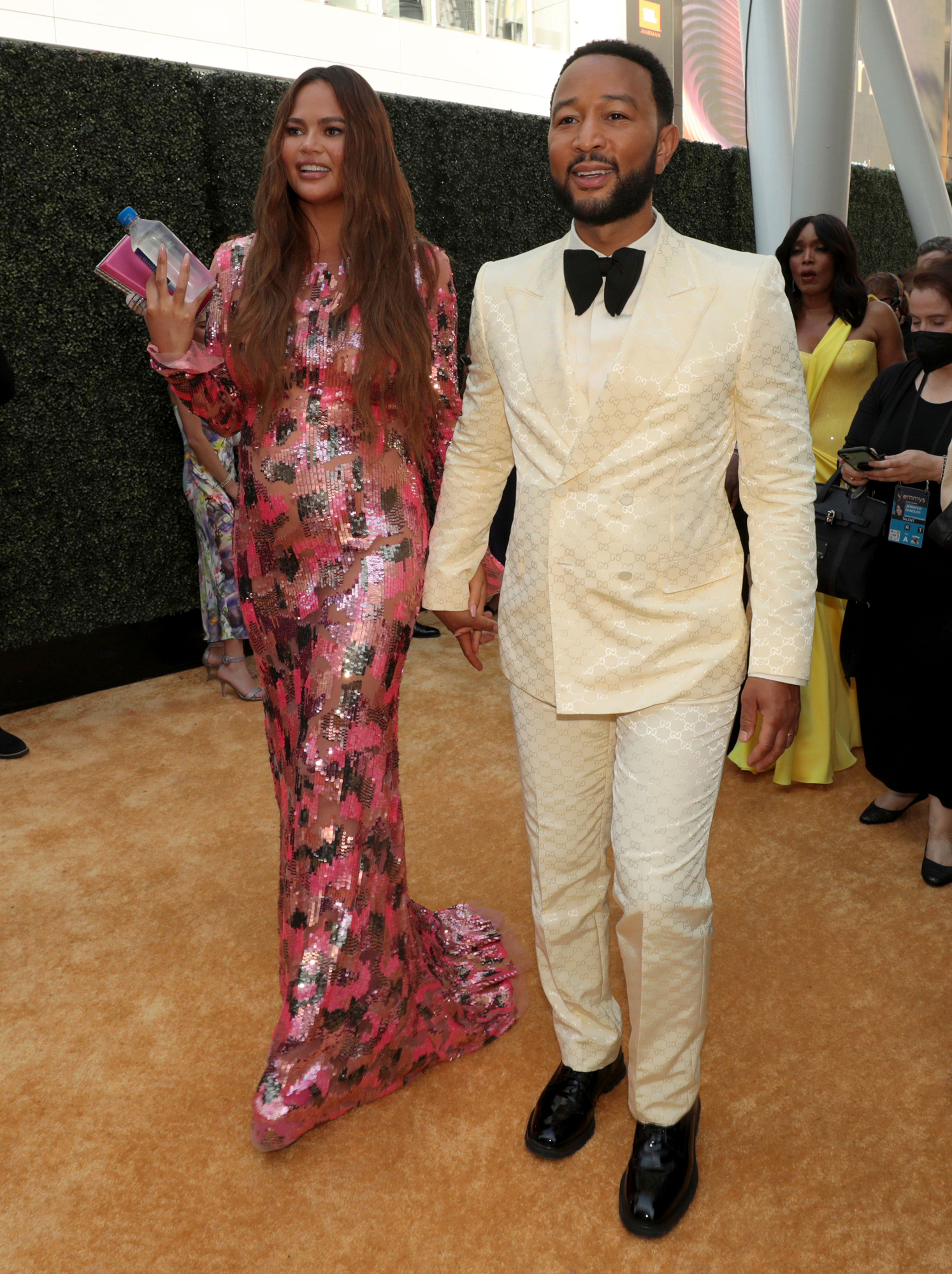 Pregnant Chrissy Teigan Shows Off Her Baby Bump Alongside Husband John Legend at the 2022 Emmy Awards Red Carpet
