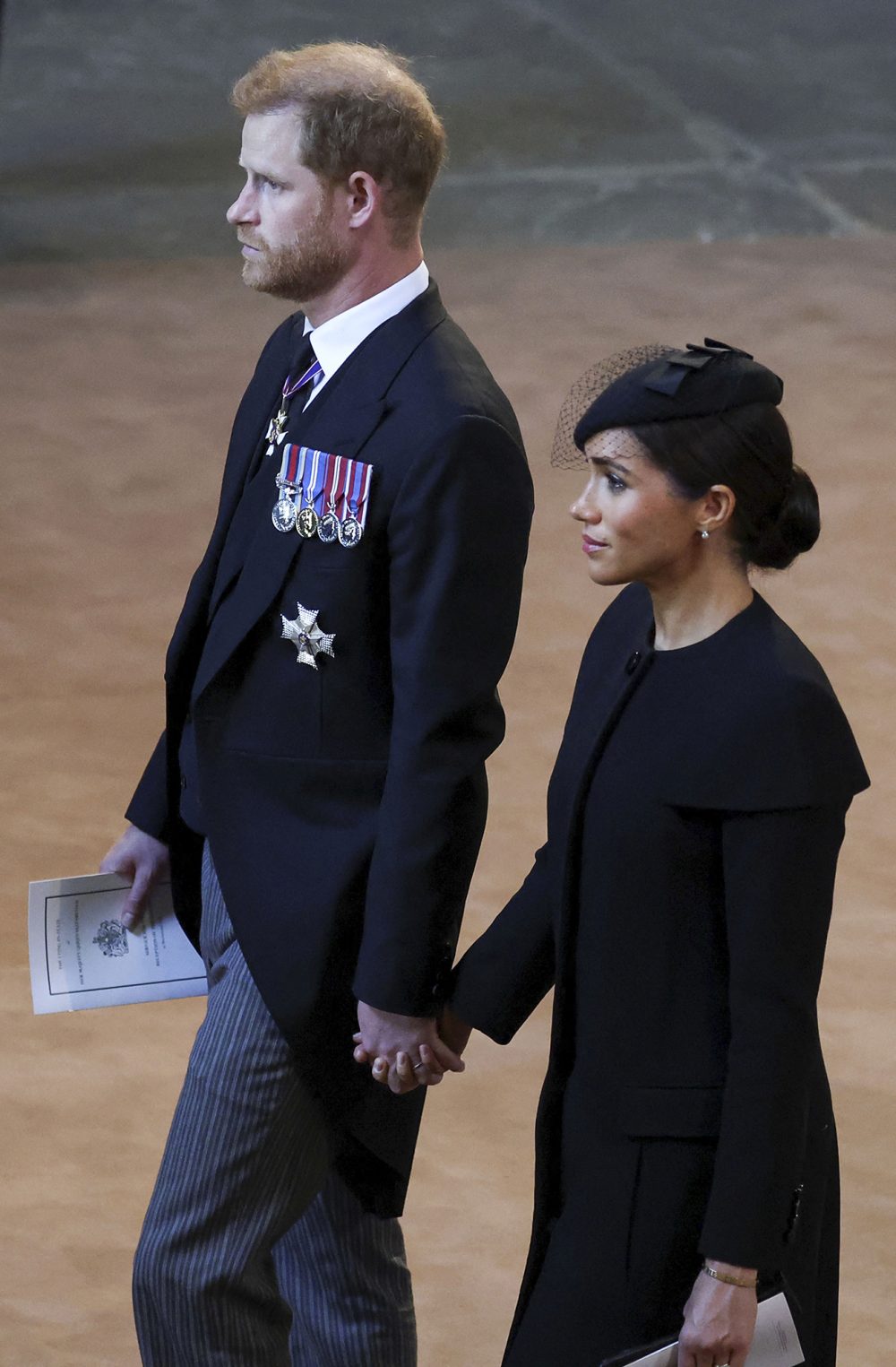 Prince Harry and Meghan Markle Hold Hands As They Exit Queen Elizabeth II&rsquo;s Westminster Hall Service