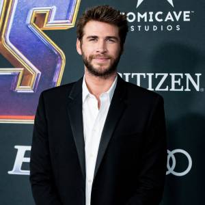 Shirtless Liam Hemsworth Cuddles — and Kisses — His Beloved Dog Dora in Adorable Photo