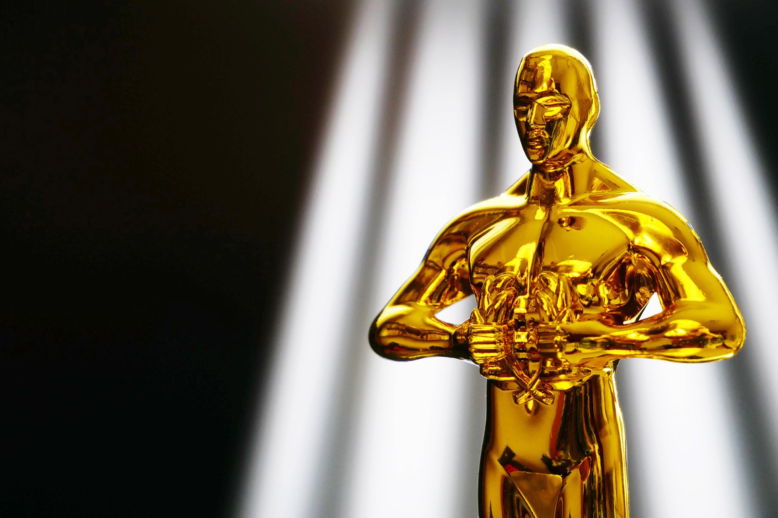 Everything to Know About the 2023 Academy Awards- Who's Hosting, Who's Nominated and More 031 032 Hollywood,Golden,Oscar,Academy,Award,Statue,On,Light,Rays,On