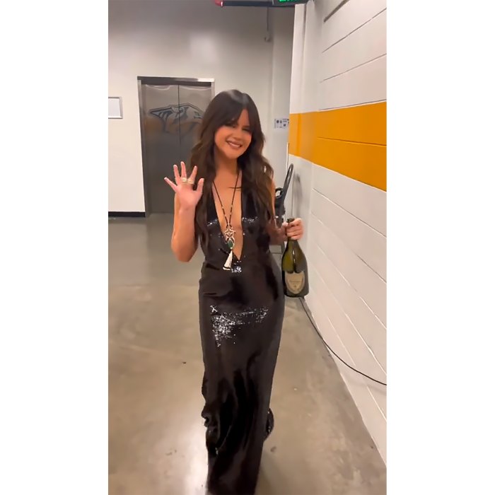 Maren Morris Walks Into 2022 CMAs With Bottle of Champagne