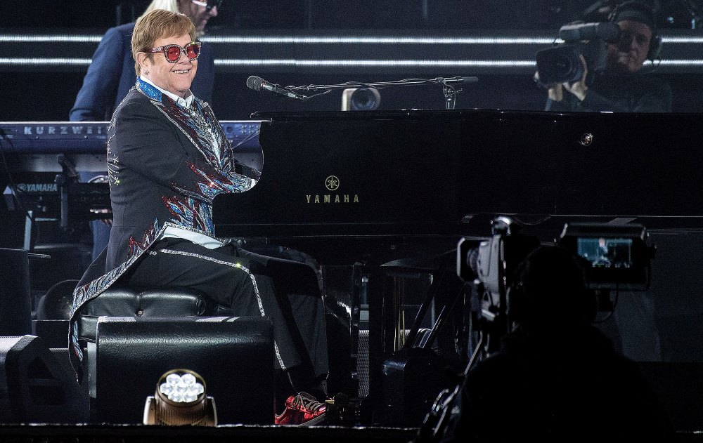 Prince Harry and Meghan Markle Get Affectionate in Sweet Tribute to Elton John at Farewell Tour 4