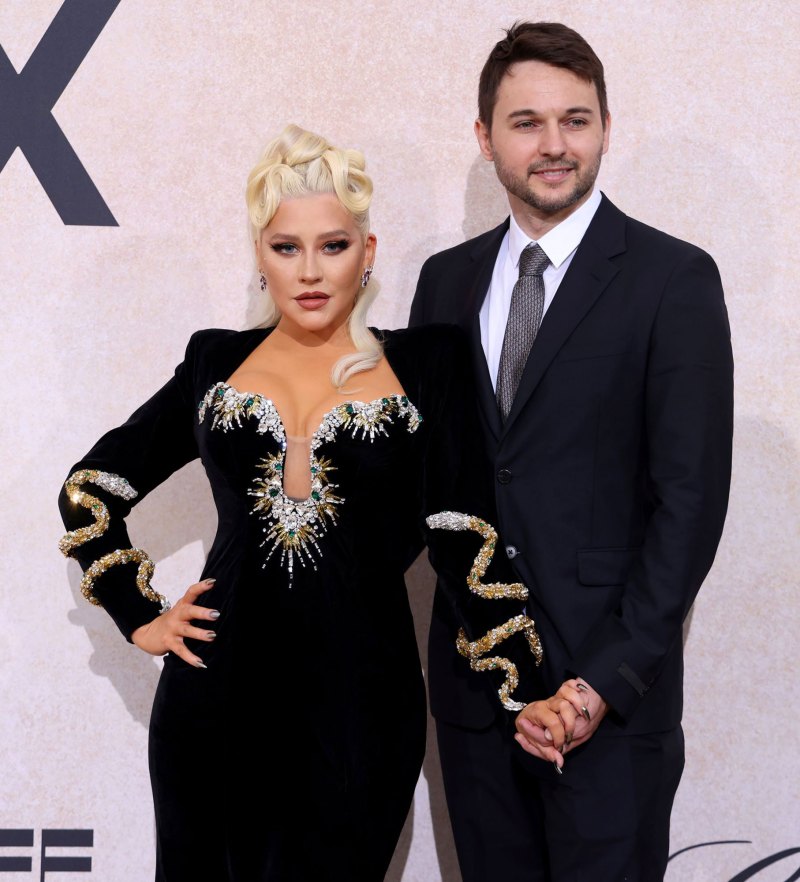 Christina Aguilera and Fiance Matthew Rutler's Relationship Timeline hands holding