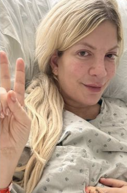 Tori Spelling Reveals She’s in the Hospital After Having a ‘Hard Time Breathing,’ Slams Haters for Claiming She Was Faking
