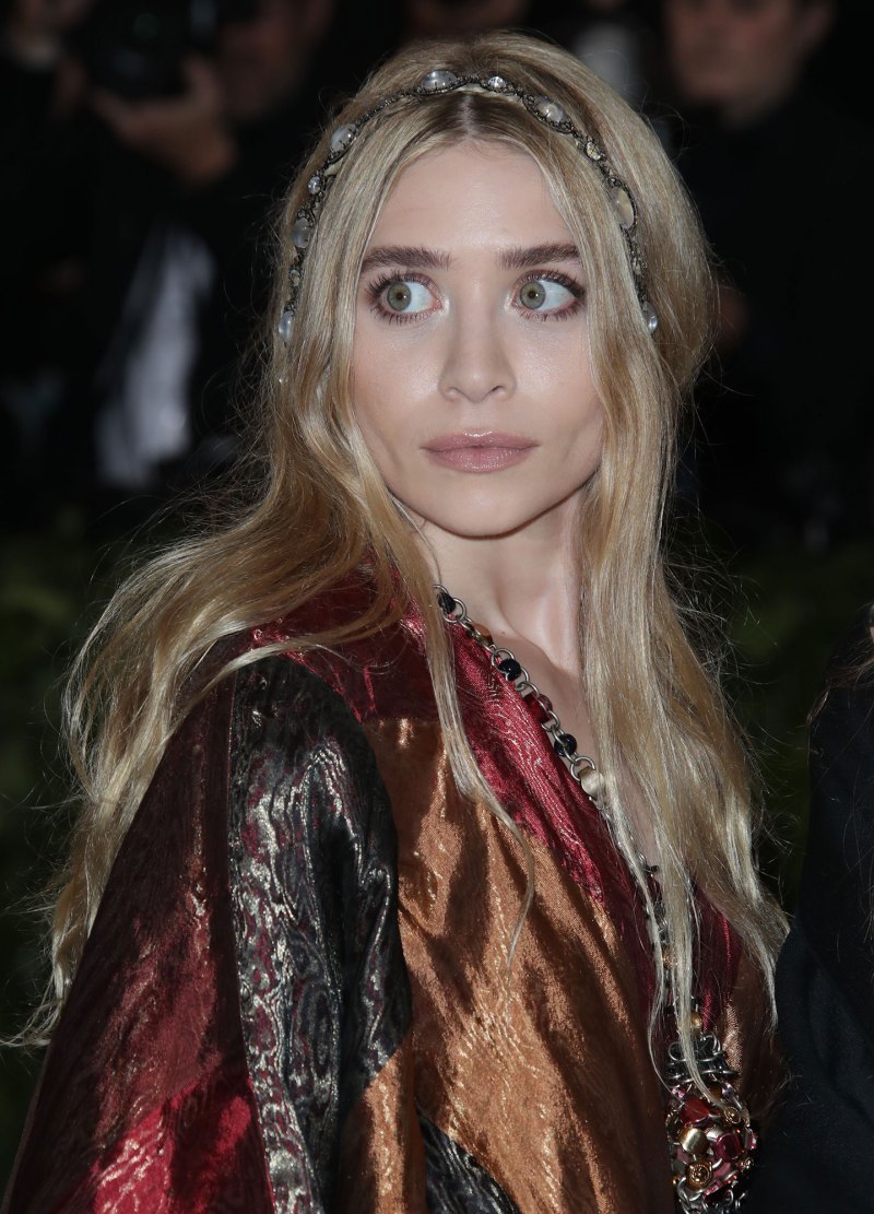 Ashley Olsen and Louis Eisner’s Relationship Timeline: Inside Their Private Romance red and orange robe