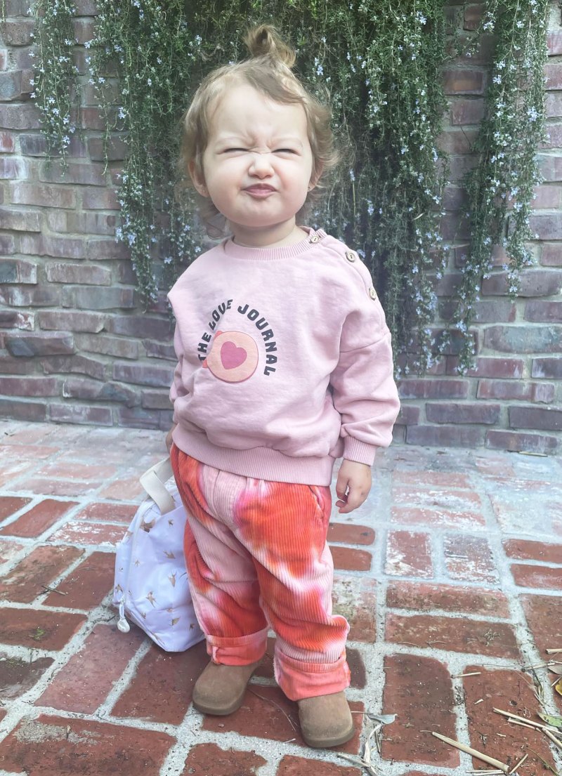 Ashley Tisdale’s Family Album With Daughter Jupiter pink sweatshirt