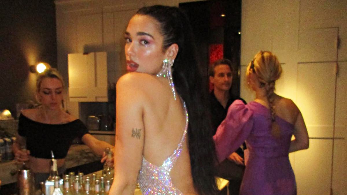 Dua Lipa Flashes Thong in Backless Dress on New Year's Eve: Pic | Us Weekly Dua Lipa Flashes Thong in Backless Dress on New Year's Eve: Pic | Us Weekly