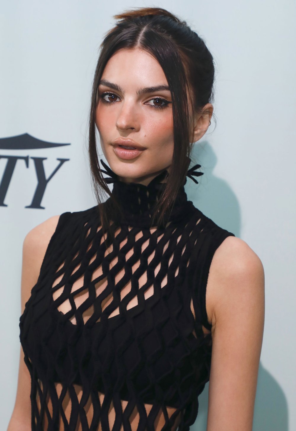 Emily Ratajkowski Opens Up About Dating ‘Emasculated' Men Amid Split From Pete Davidson: ‘I Feel Like I Attract The Worst Men’ fishnet dress