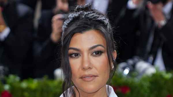 Kourtney K Does Pilates in Skims Pajamas white shirt