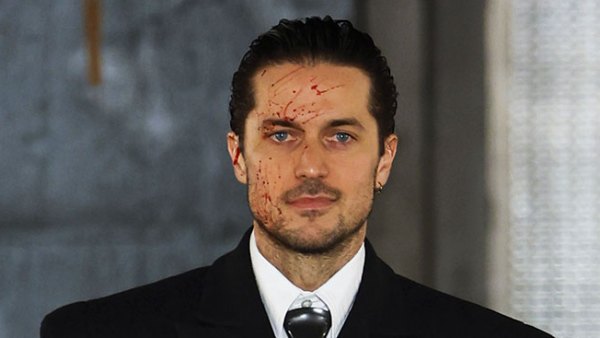 Lucas Bravo Takes American Psycho Themed Runway blood splatter face