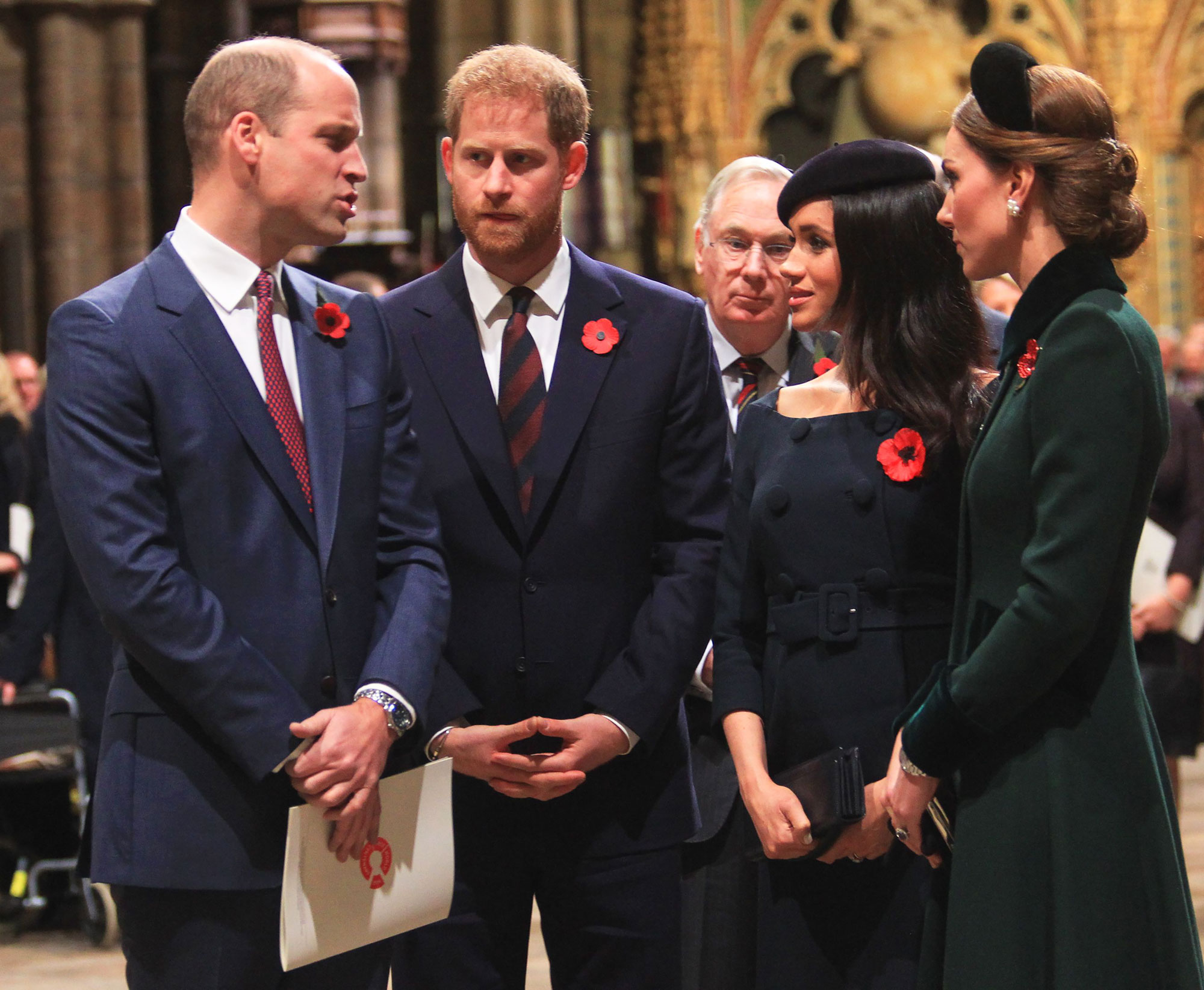 Prince Harry gestures in the gardens of Buckingham Palace in London kate green coat