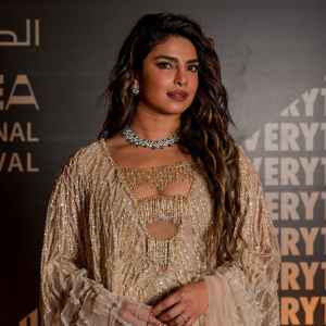 Priyanka Chopra Offers Rare Glimpse at Life as a Mother, Gushes Over Her Marriage to Nick Jonas gold dress