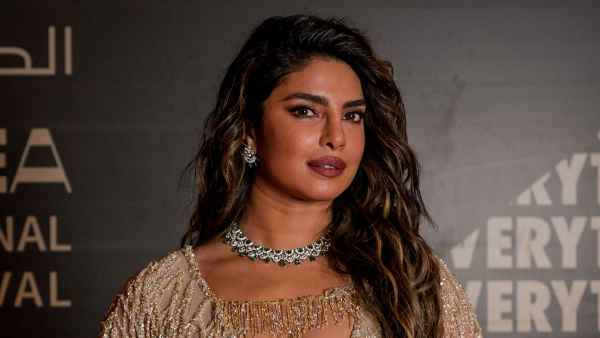 Priyanka Chopra Offers Rare Glimpse at Life as a Mother, Gushes Over Her Marriage to Nick Jonas gold dress