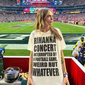 Cara D Wears Team Rihanna Shirt at Super Bowl football field