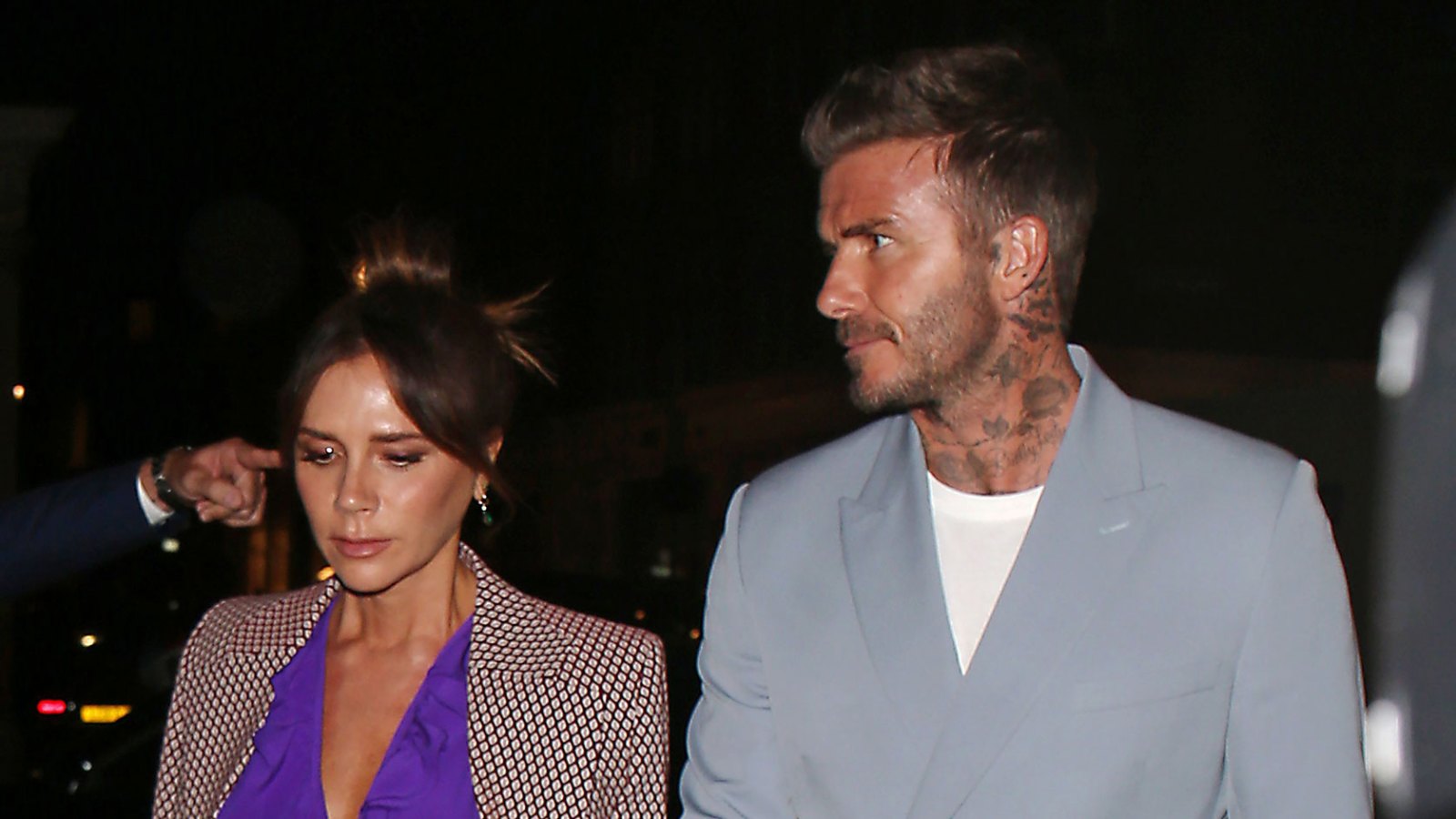 David and Victoria Beckham: A Timeline of Their Relationship purple shirt