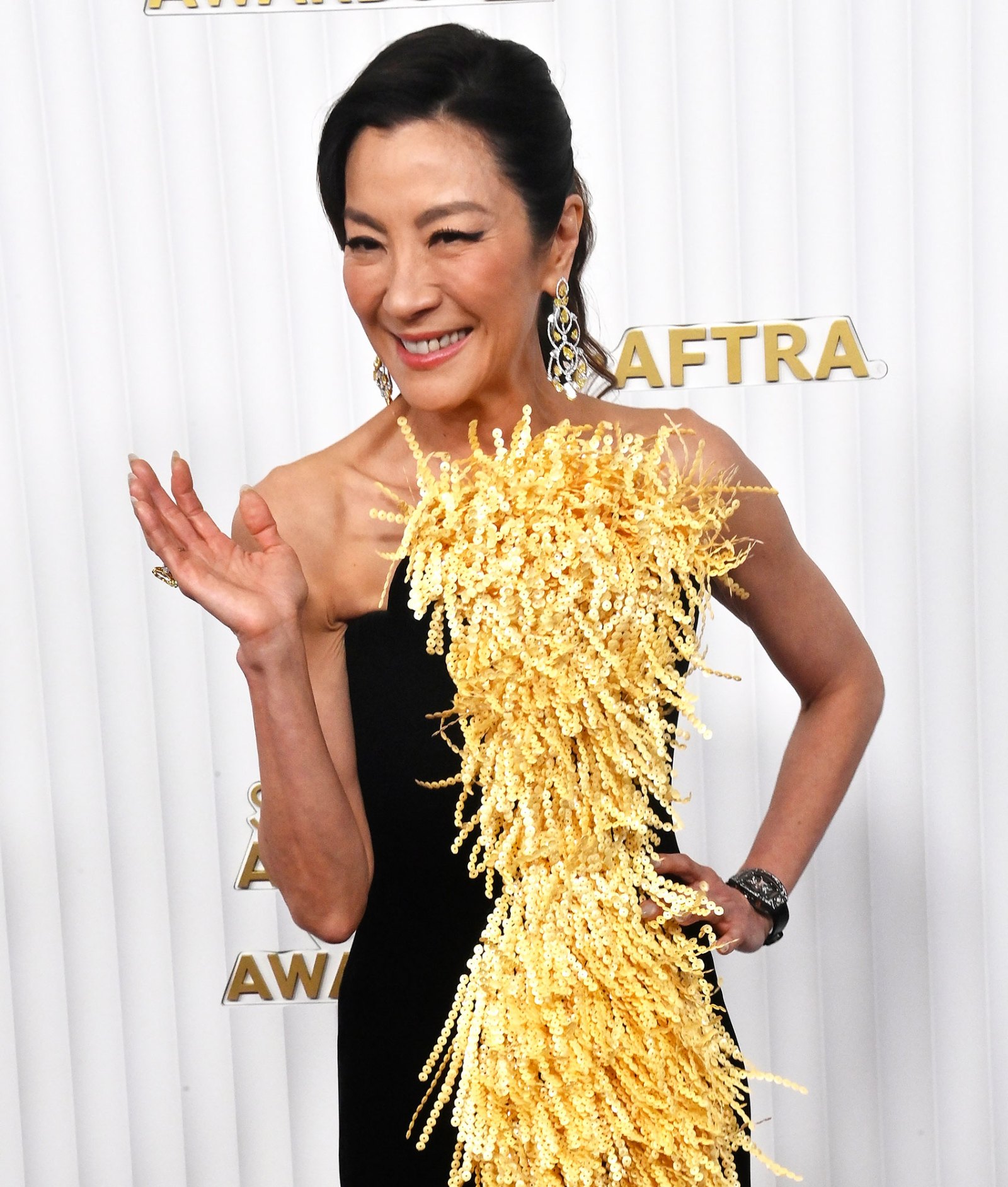 Michelle Yeoh's Schiaparelli SAG Awards Gown Is Dividing the Internet: See Her Fringe Ensemble wave SAG Awards 2023