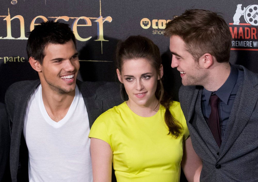 Taylor Lautner Says 'Twilight' Fans' Jacob Vs. Edward Rivalry 'Definitely' Impacted Robert Pattinson Friendship white t shirt