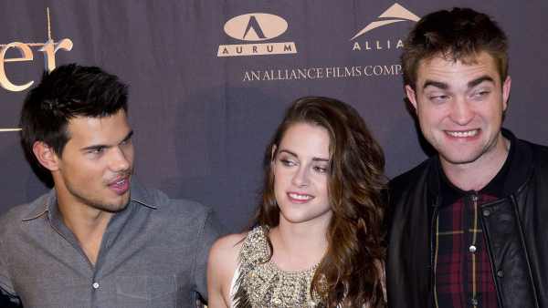 Taylor Lautner Says 'Twilight' Fans' Jacob Vs. Edward Rivalry 'Definitely' Impacted Robert Pattinson Friendship grey shirt