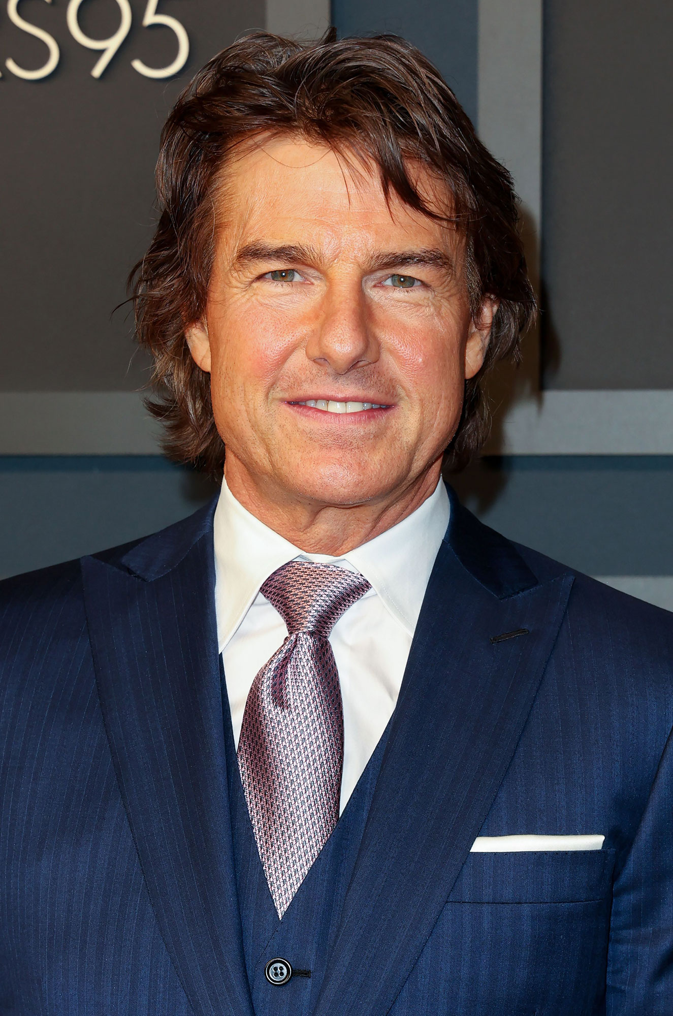 Tom Cruise Shows of Longer Locks and a Sun-Kissed Tan: Photos