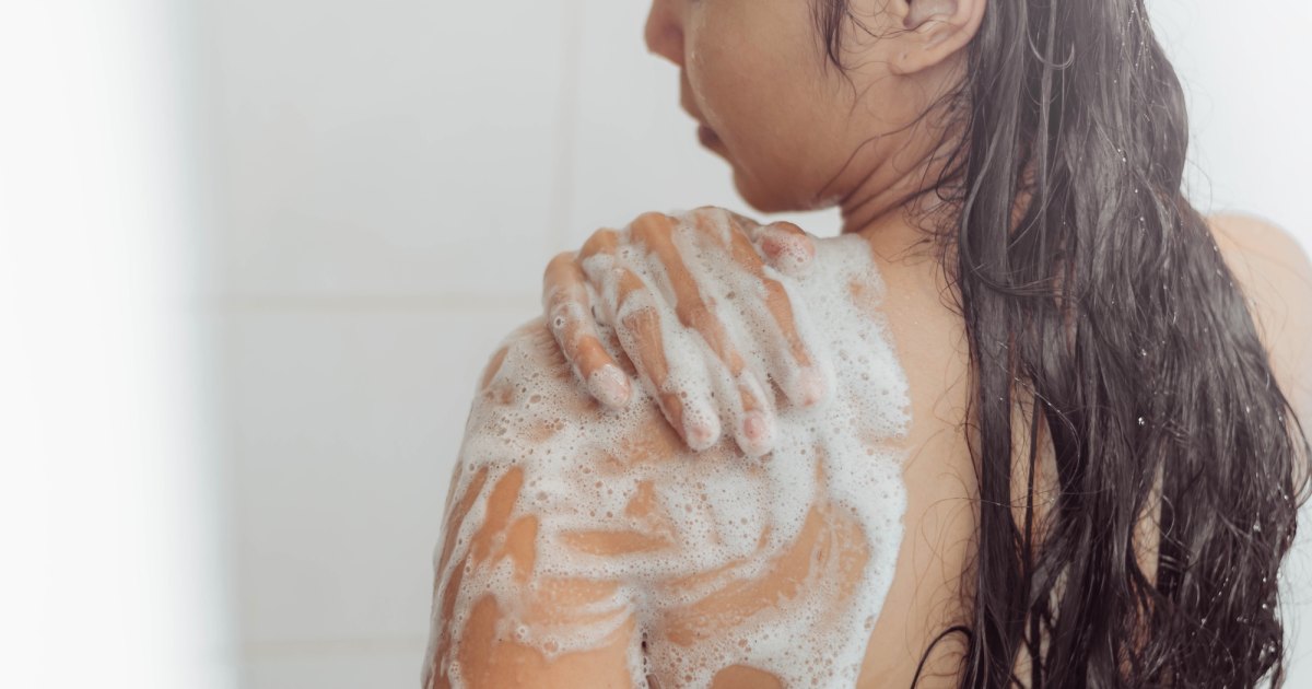 Woman Using Body Wash Stock Photo