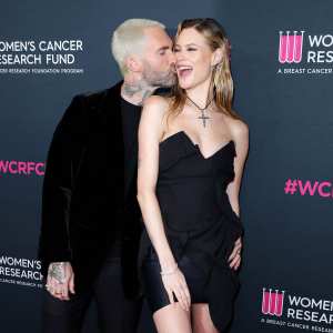 Adam Levine and Behati Prinsloo Share Red Carpet Kiss