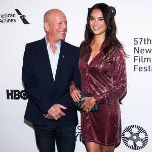 Emma Heming Slams Claim She's Using Bruce Willis' Diagnosis for Fame maroon dress