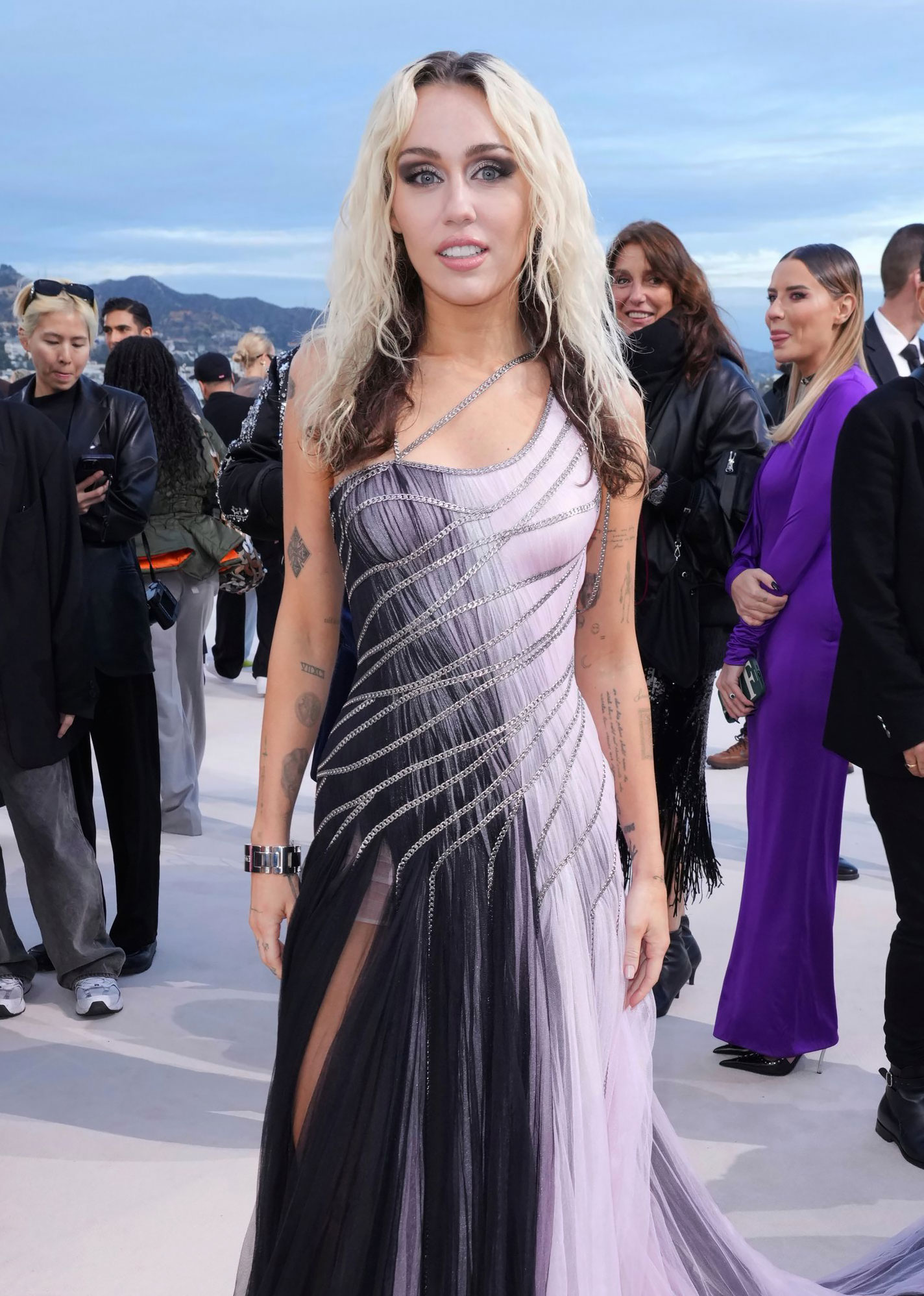 Miley Cyrus Brings the 'Grime and Glamour' on 8th Album ‘Endless Summer Vacation’: Lyric Breakdown purple dress