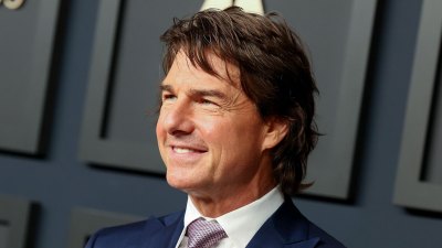 Tom Cruise Is 'Over the Moon' About Oscars Recognition for 'Top Gun' — and Pal Andrea Riseborough's Nomination blue suit